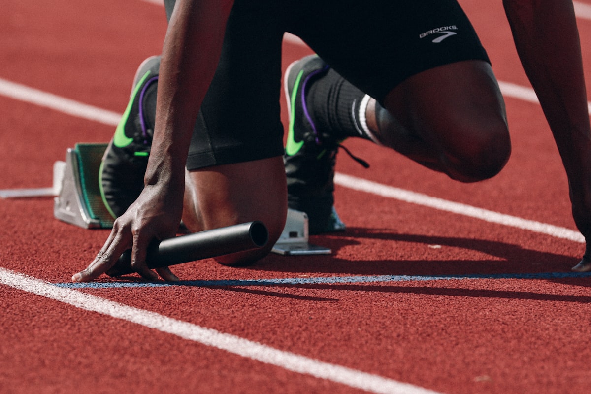 Athlete running representing the body choosing between fat and glucose as metabolic fuel