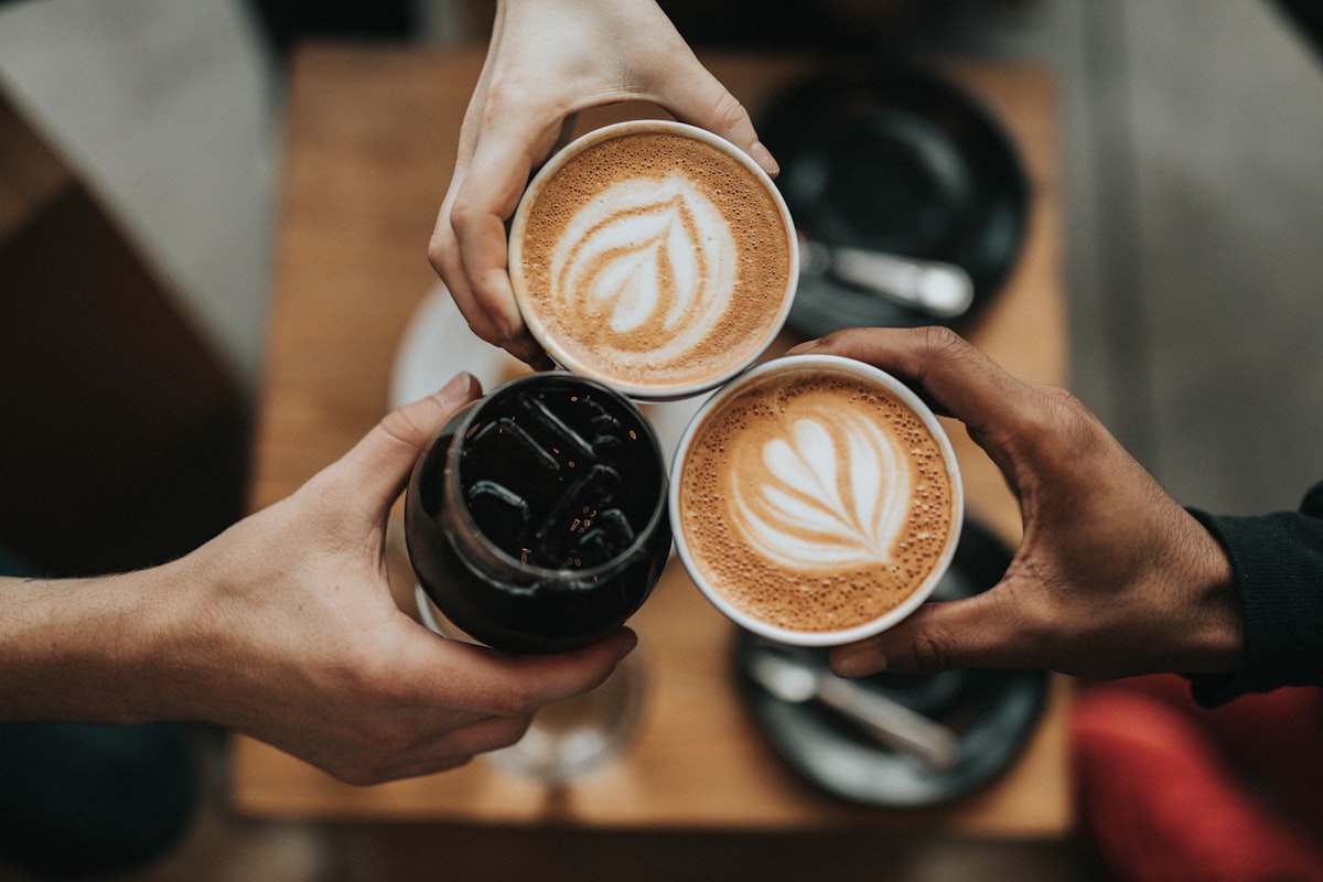 Warm cup of mushroom coffee on a wooden surface